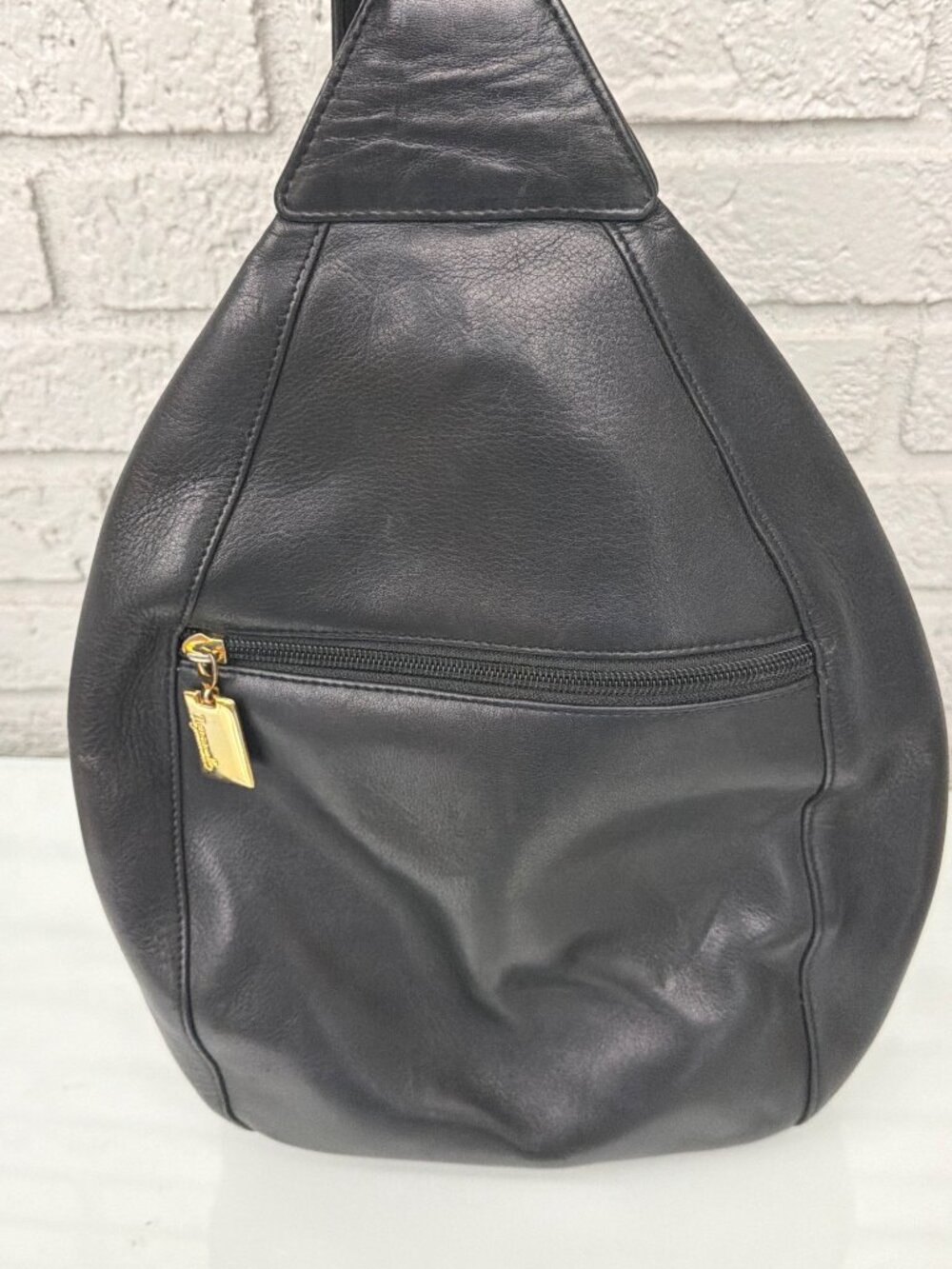 Tignanello Black Leather Teardrop Sling Backpack Crossbody Bag Purse